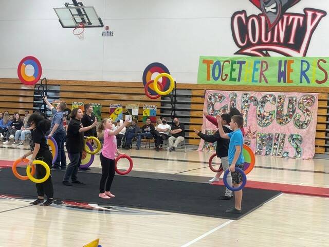 Students at Robertson County School toss spinning rings to each other as part of their performance in Circus Minimus recently at Robertson County Schools.