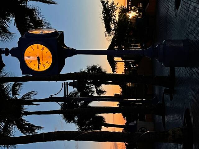 
			
				                                The sky and Times Square clock of Fort Myers Beach, Florida, glow with the setting sun.
 
			
		