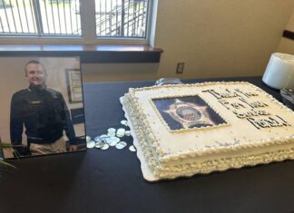 
			
				                                A cake and picture sit on a table for Mason County Sheriff Patrick Boggs’ retirement celebration.
 
			
		